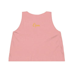 Back view of pink women's cropped tank top with yellow 'Opm' script