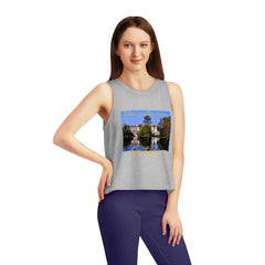 Woman wearing grey cropped tank top with architectural print and text, urban streetwear fashion