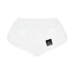 White women's relaxed shorts with elastic waist and a small black logo patch on front