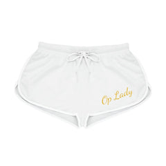 White women's relaxed fit shorts with elastic waistband, side split hem, and Op Lady script in gold.